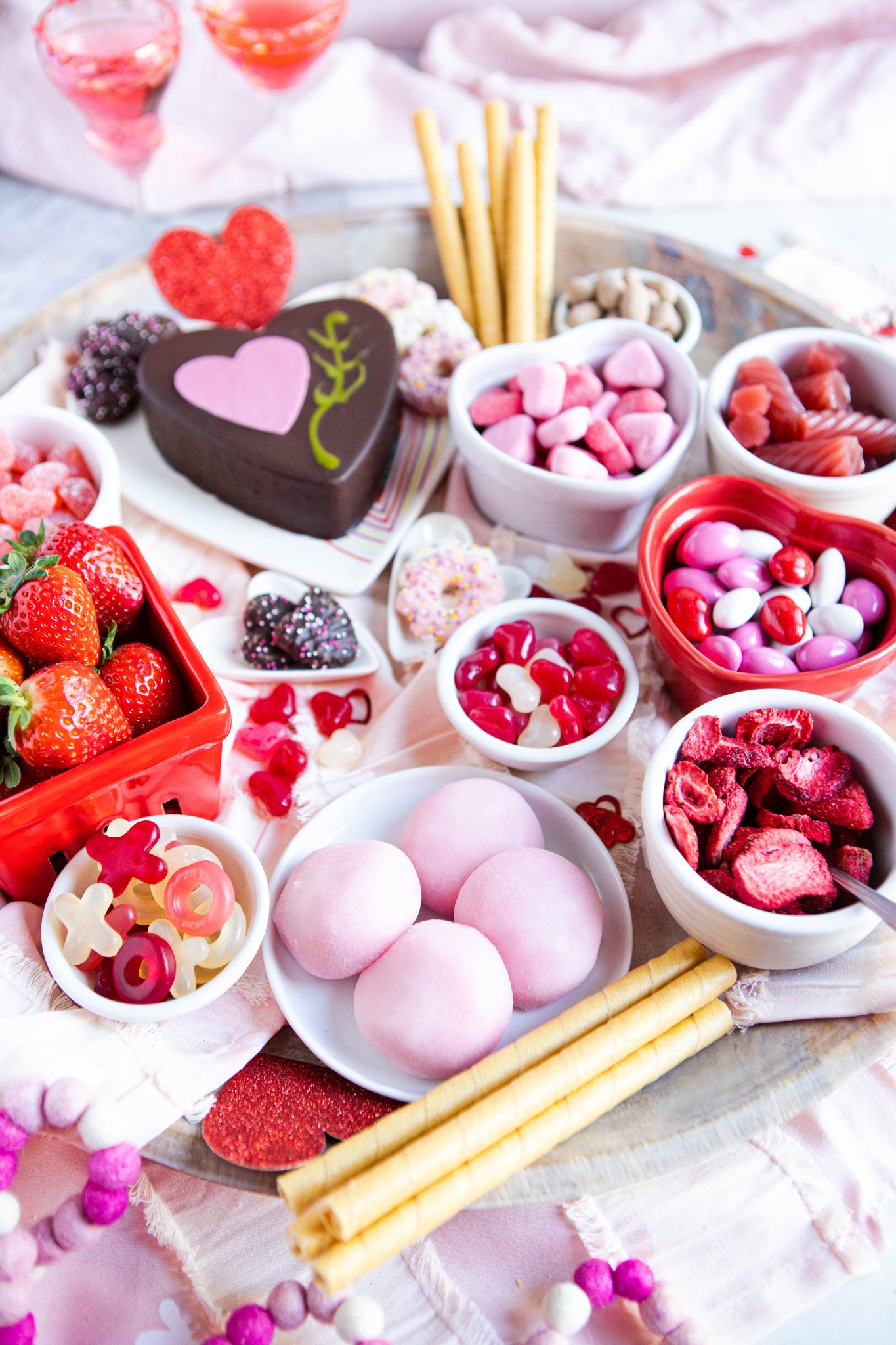 red and pink desserts arranged artfully on a platter for Valentine's Day