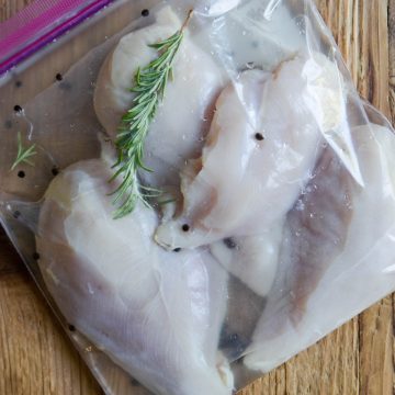 chicken breasts in a salt water brine with rosemary and black peppercorn