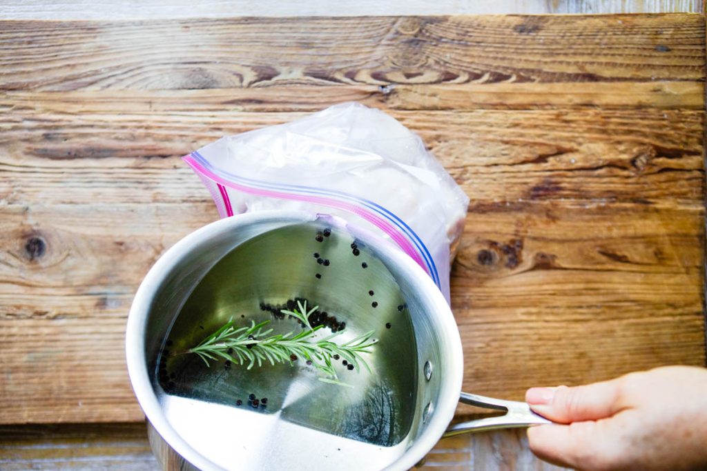 chicken brine added to a Ziploc bag with chicken breasts