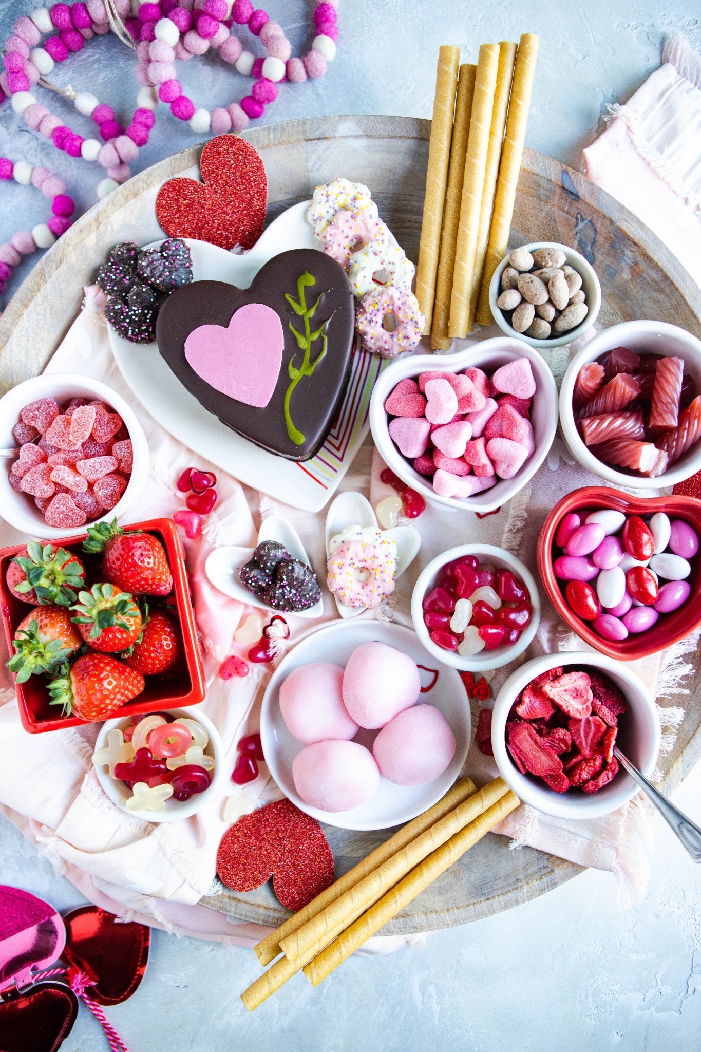 Sweets from Trader Joe's arranged on a wood platter for a dessert charcuterie board