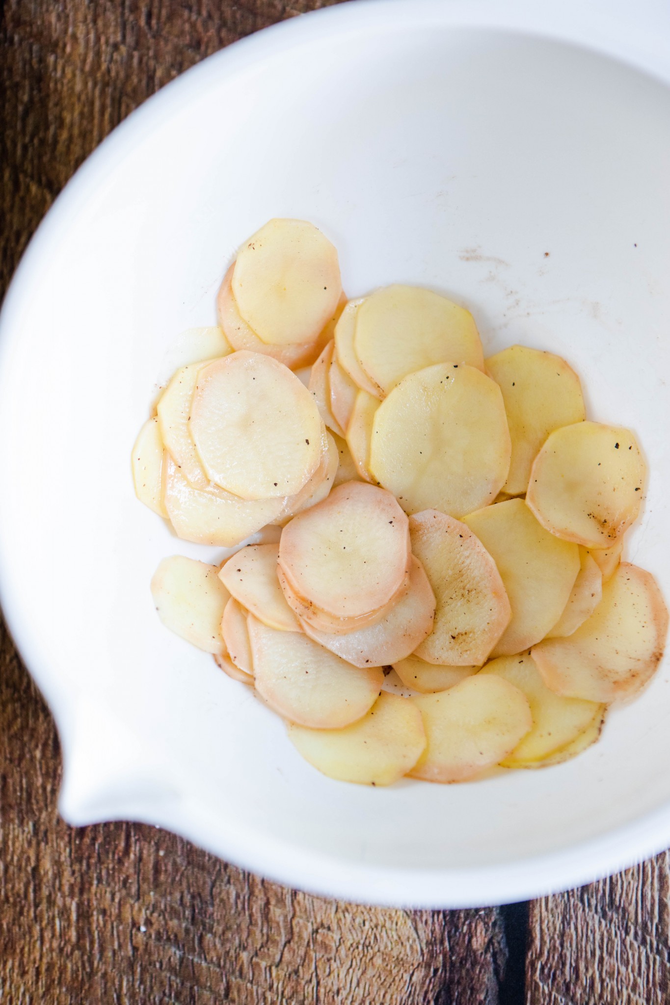 truffle potato chips sliced in a white bowl