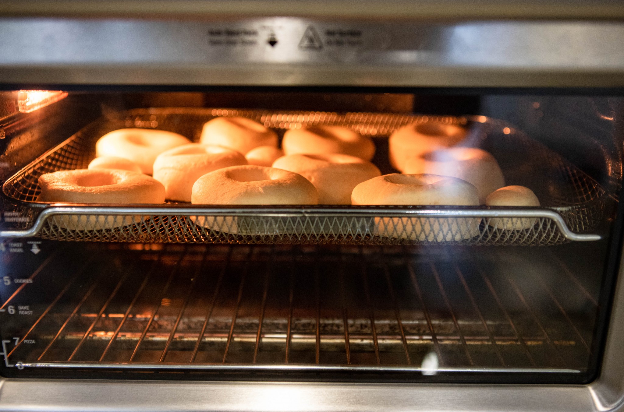 donuts in air fryer being cooked