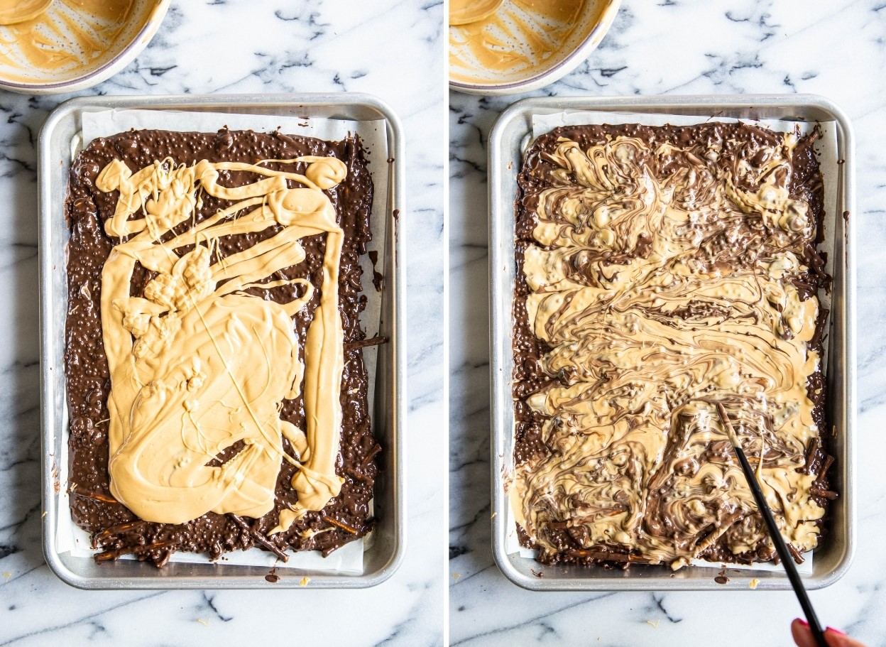 dark chocolate bark being made in process, topped with melted peanut butter chips