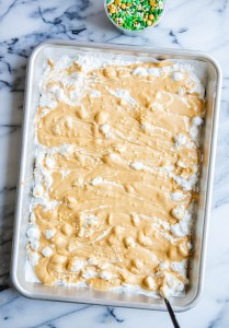 white and peanut butter chips melted together on a sheet pan