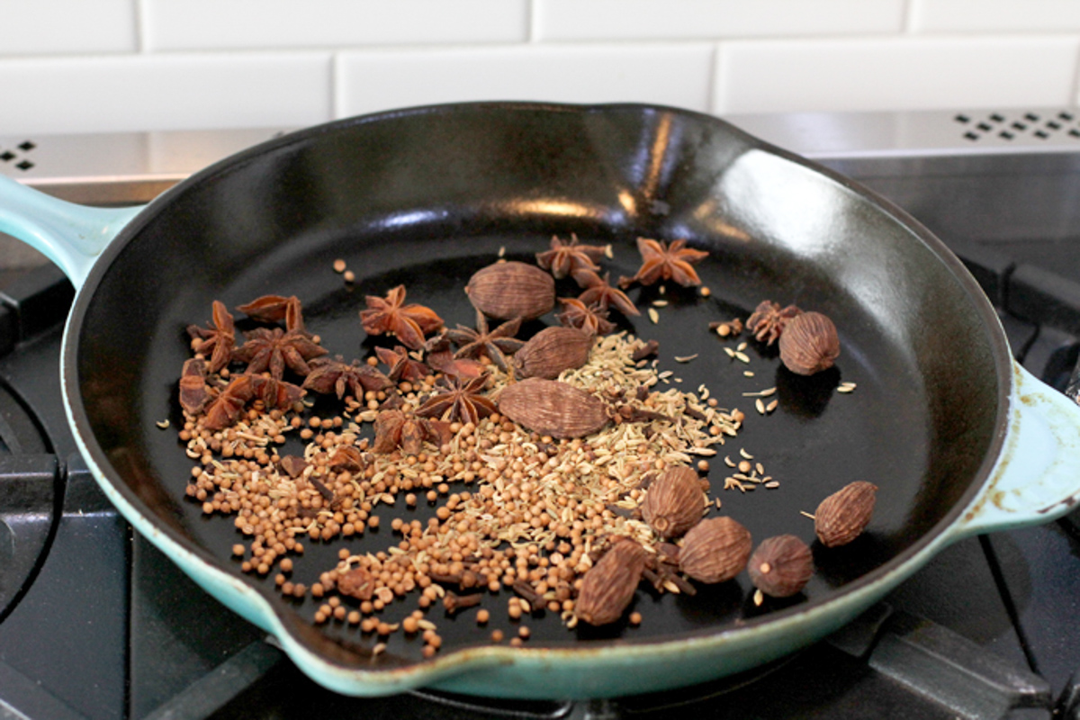 anise, cardamom, fennel and coriander toasting in a skillet