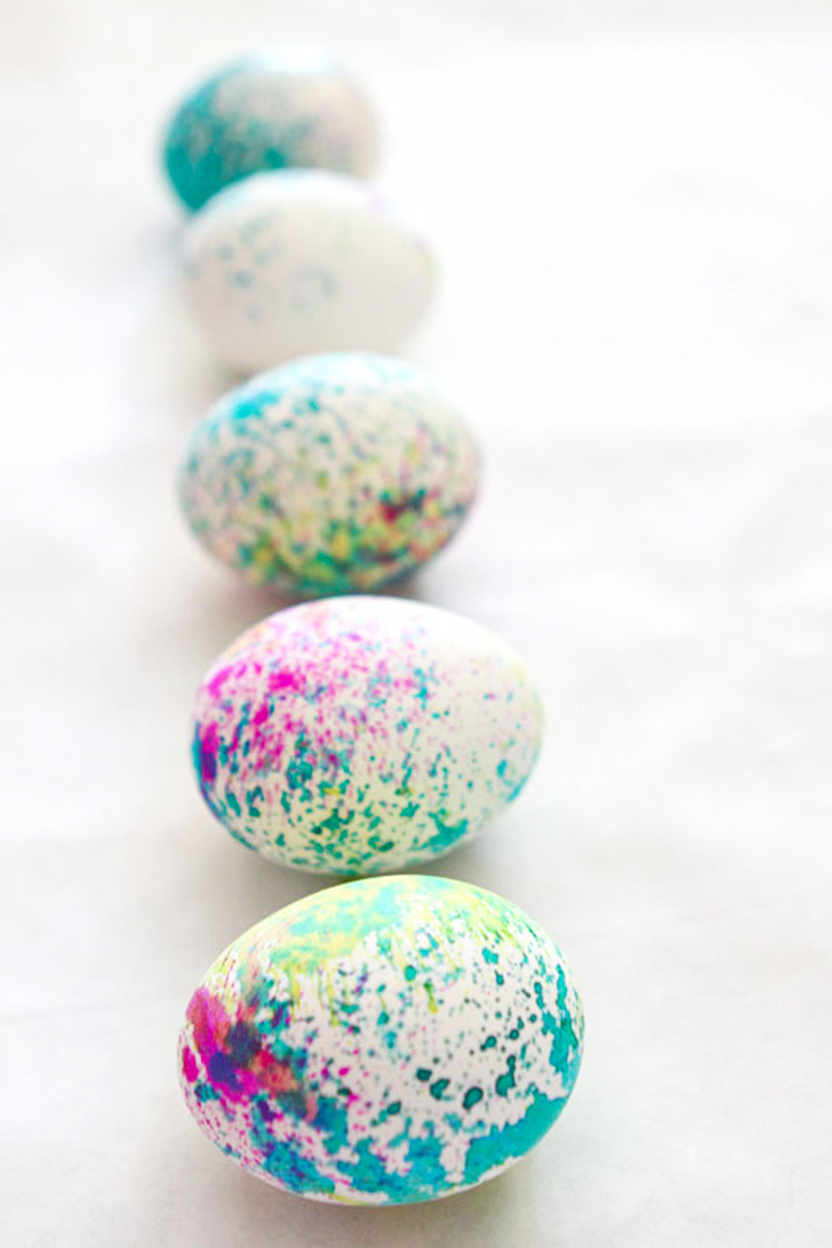 watercolor easter eggs sprayed with liquid watercolors
