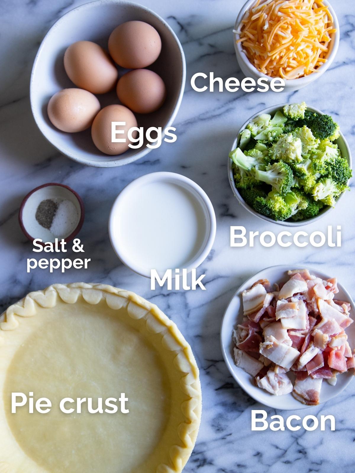 raw ingredients to make a broccoli and bacon quiche in round white bowls