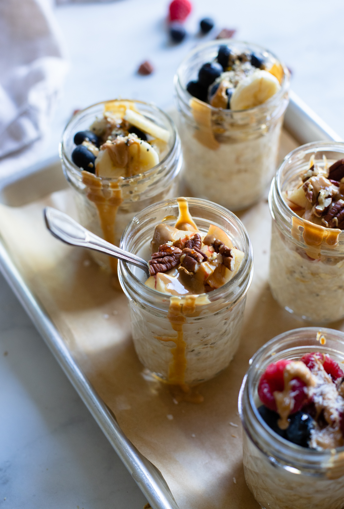 side angle of 8 ounce mason jars filled with overnight oats