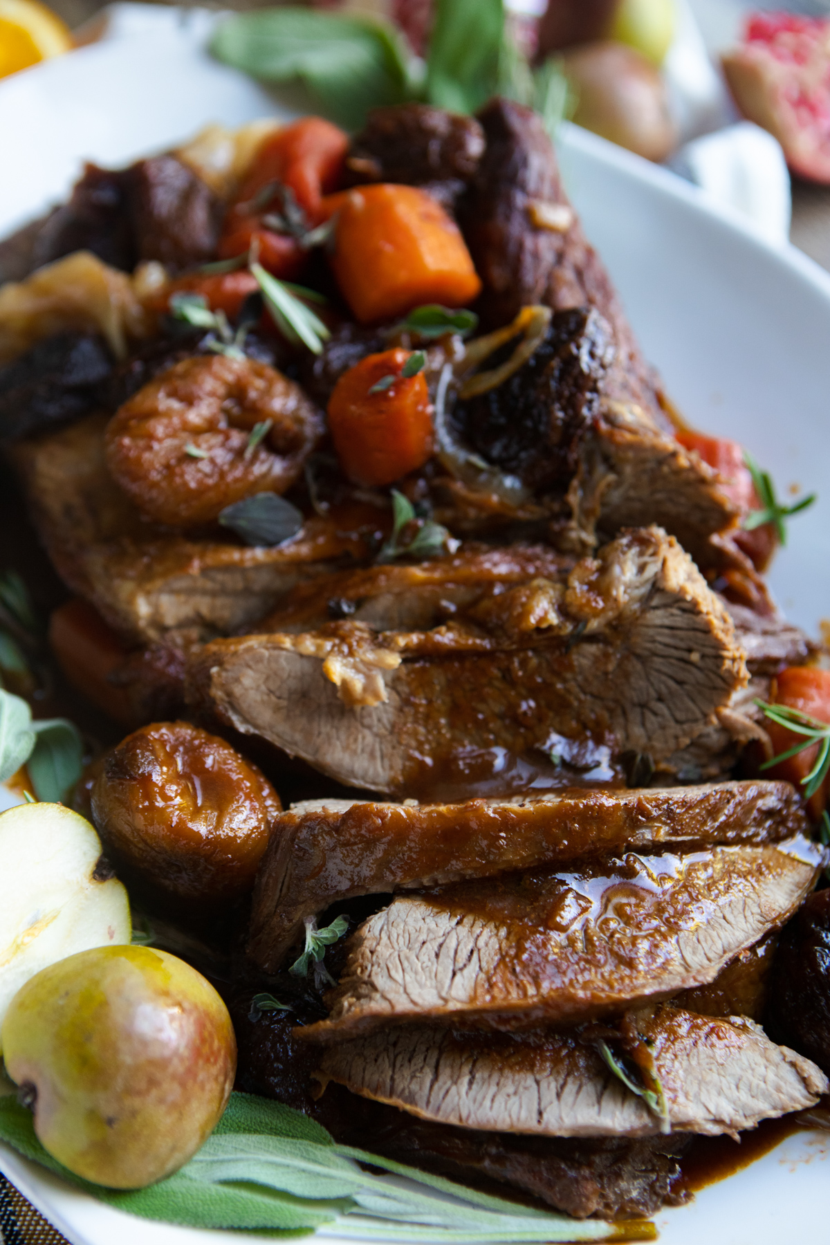 sliced beef Christmas brisket recipe with rich wine sauce gravy poured on top 