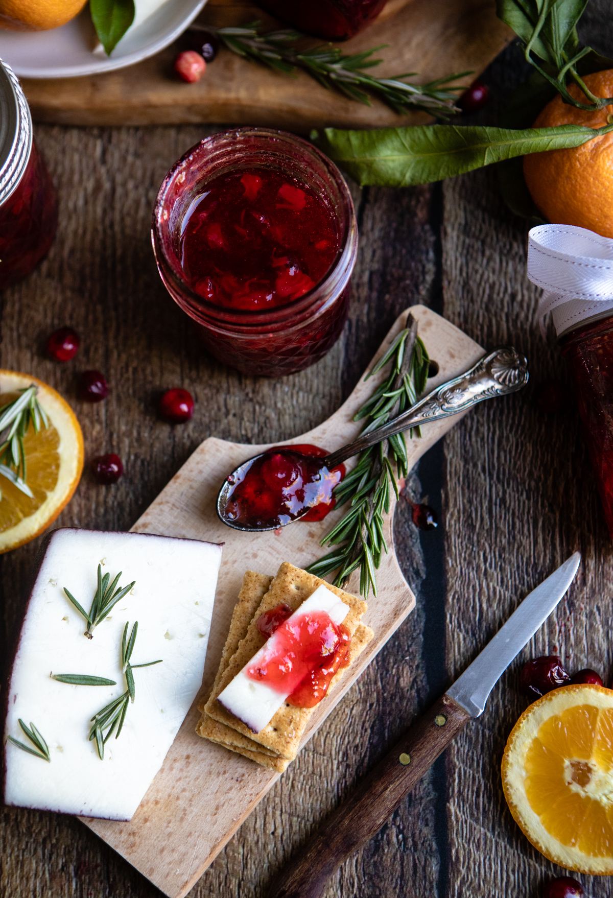 Sliced cheese and crackers topped with cranberry jam