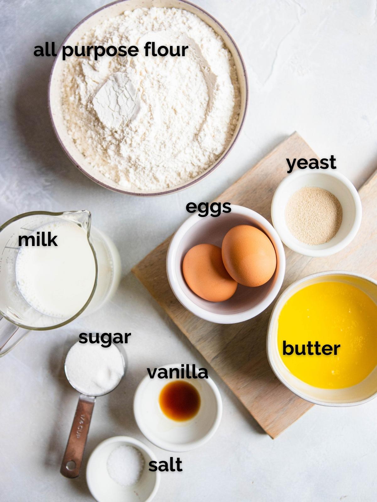 ingredients to make air fryer donuts in little white bowls