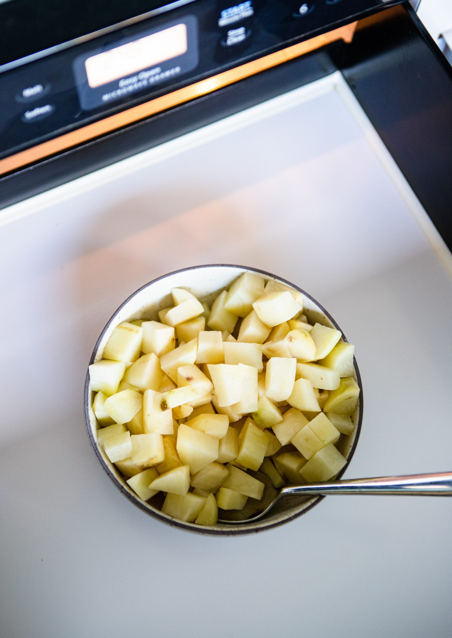 diced potatoes in a bowl ready to go into the microwave