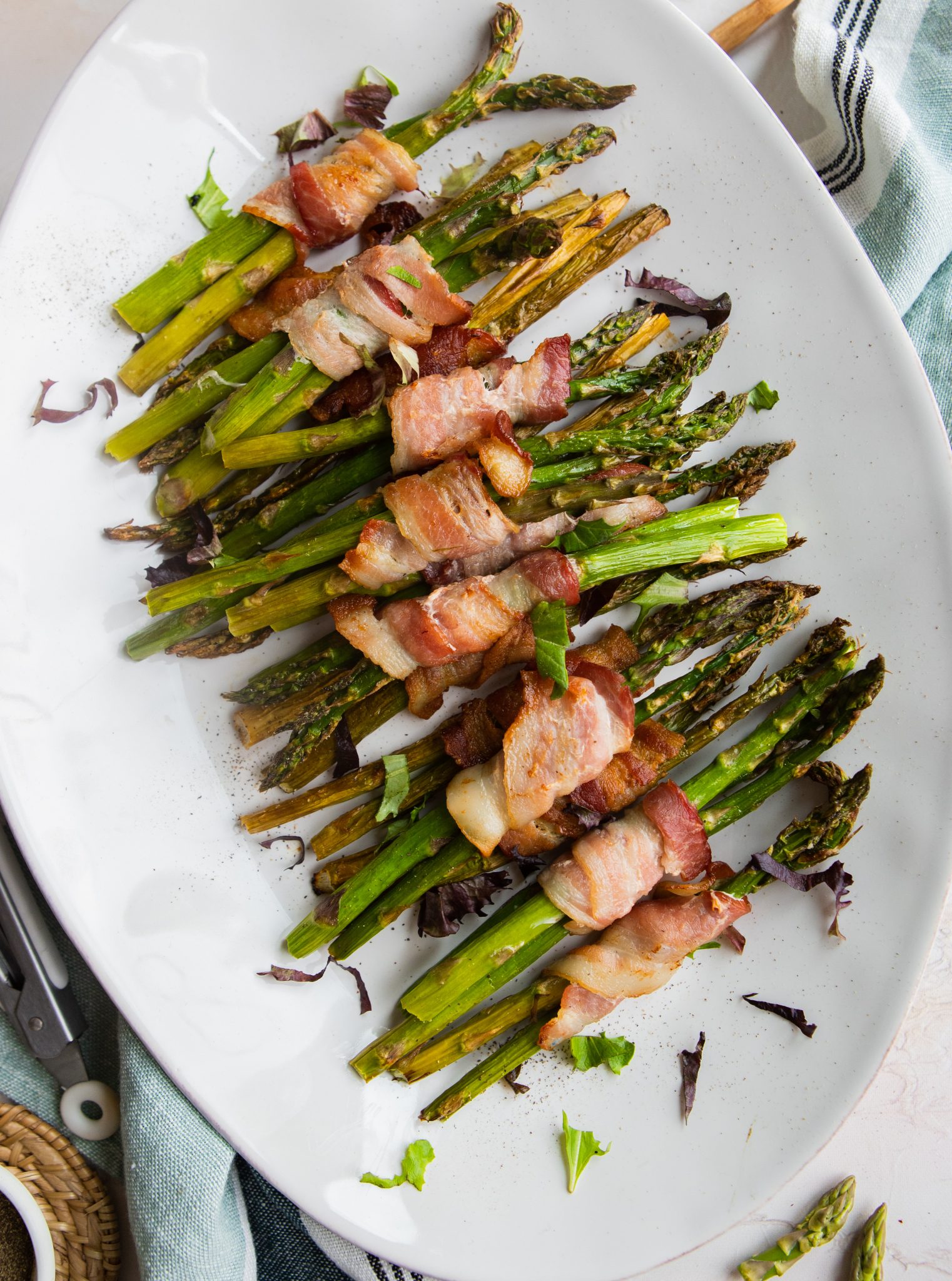 white platter with bacon wrapped asparagus air fryer cooked 