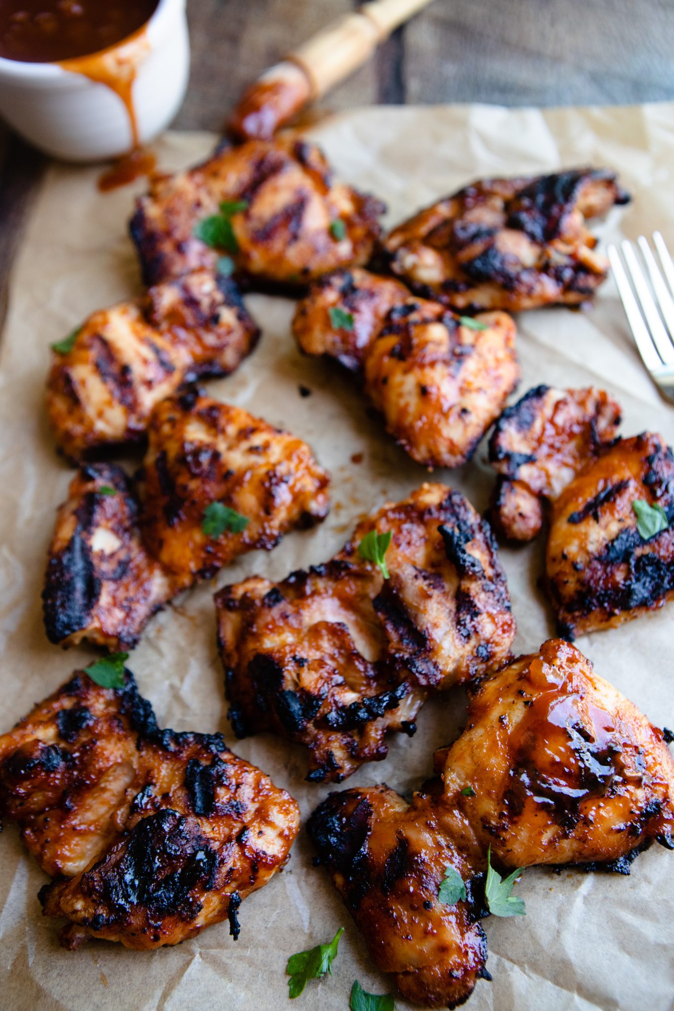 grilled boneless skinless chicken thighs basted with BBQ sauce
