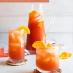 glass pitcher and glasses filled with fruit tea