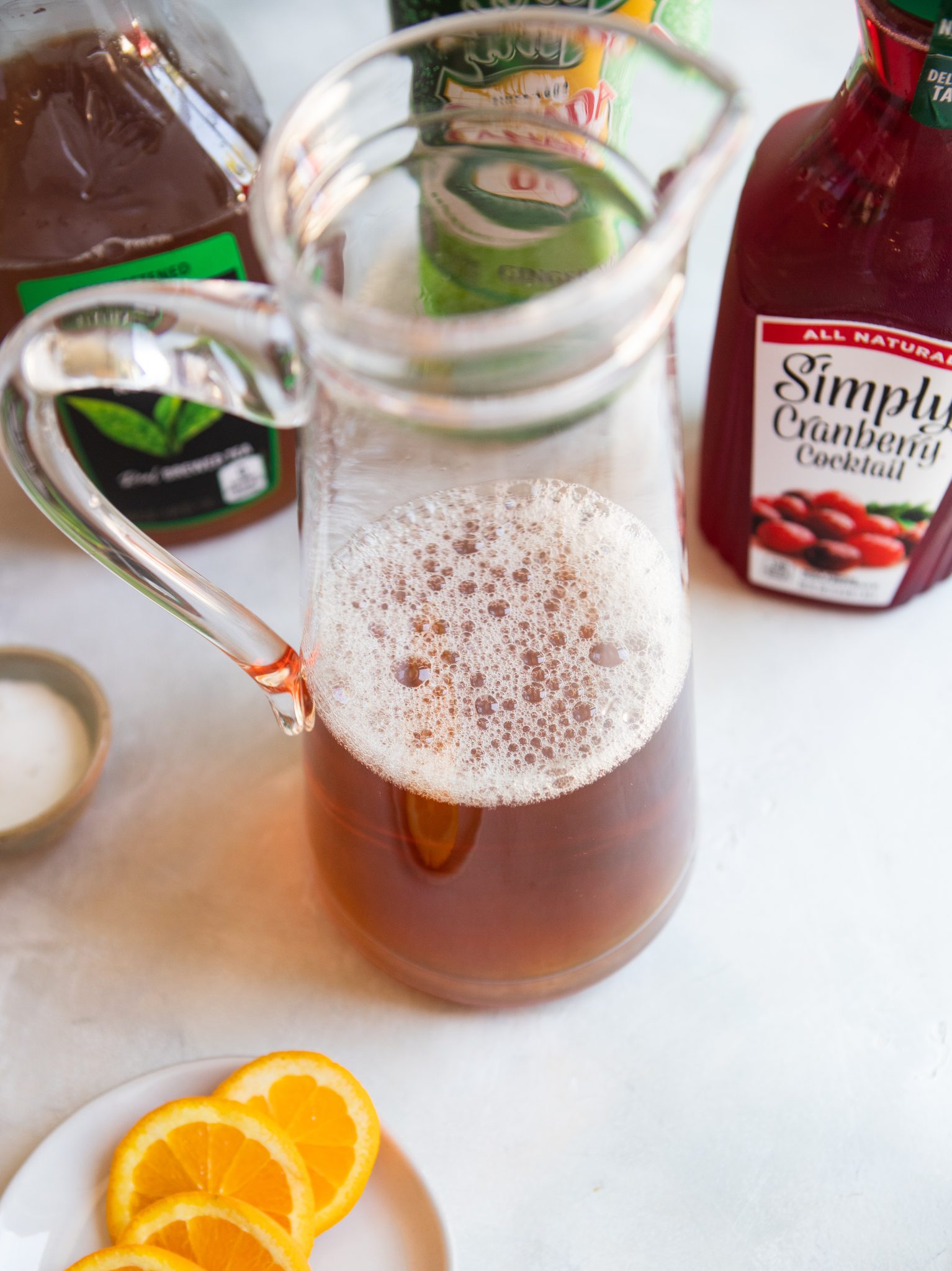 glass pitcher filled with iced tea