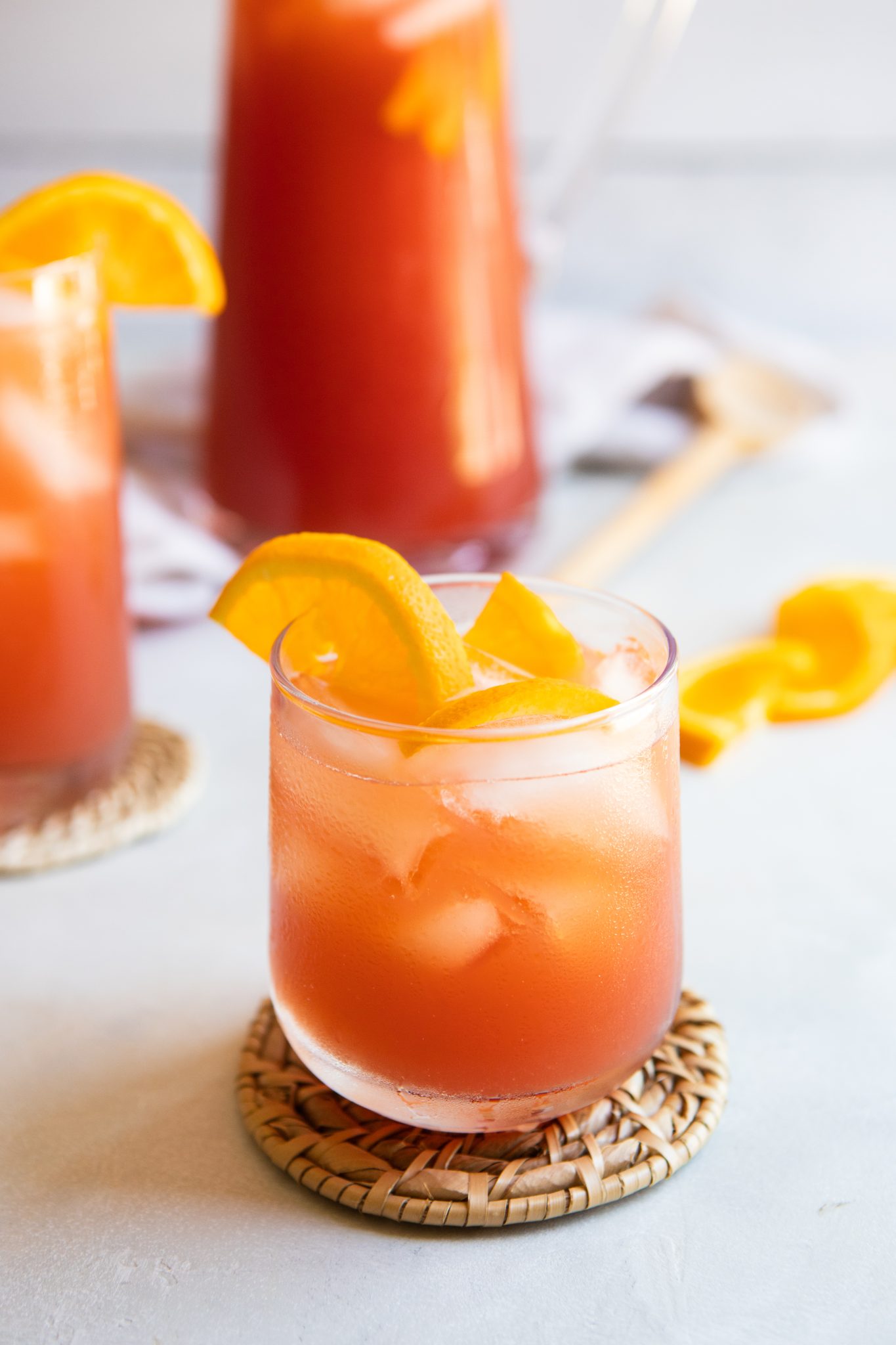 fruit tea recipe in a glass garnished with orange slices