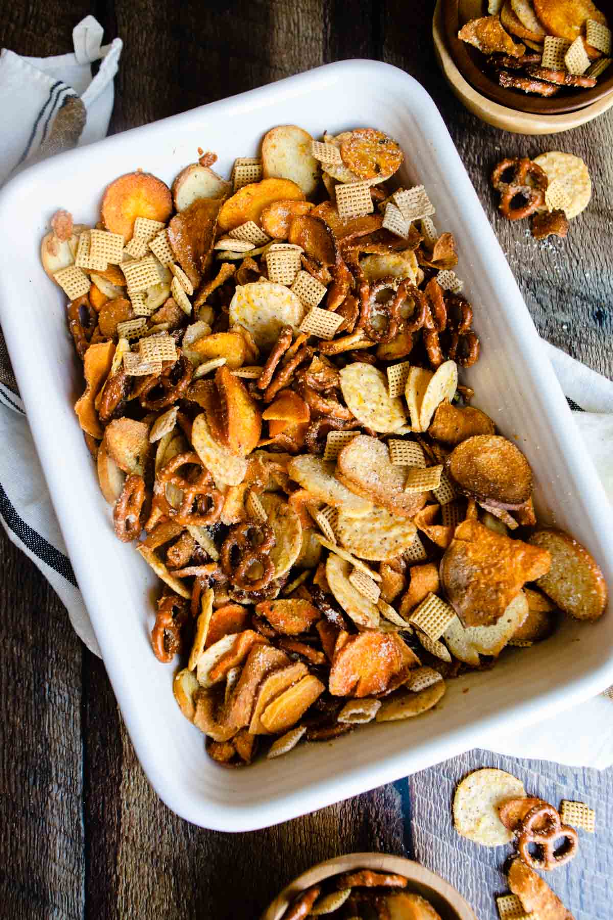 baking dish filled with cheesy snack pub mix 