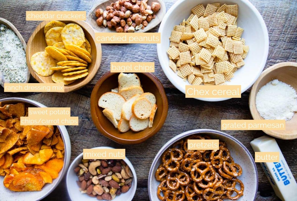 ingredients to make bold chex mix set in small white bowls