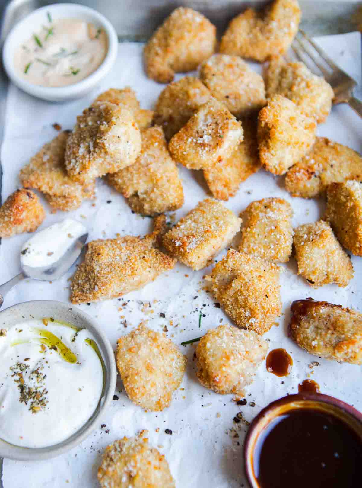 air fryer chicken bites on a serving tray with dipping sauce