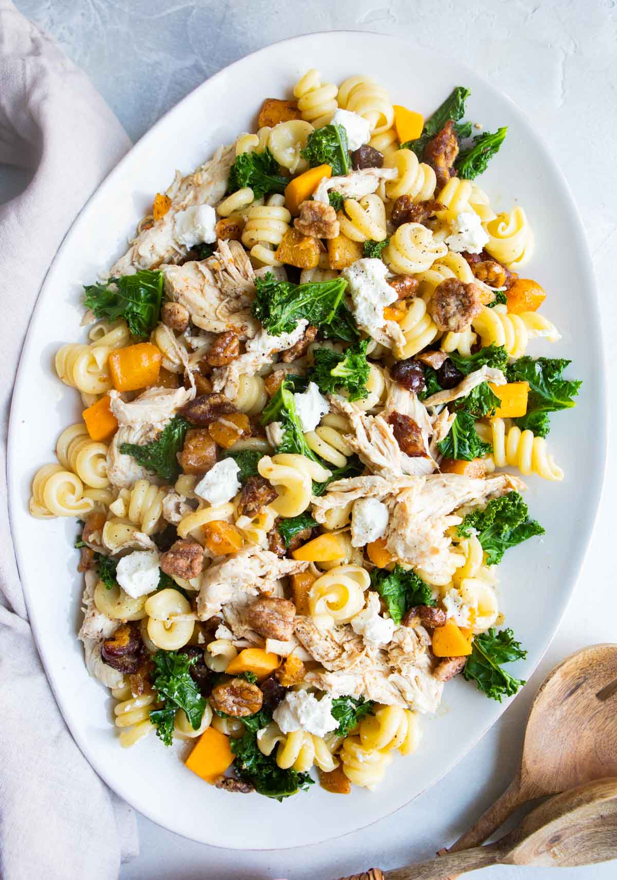 hearty pasta salad with chicken on a white serving platter