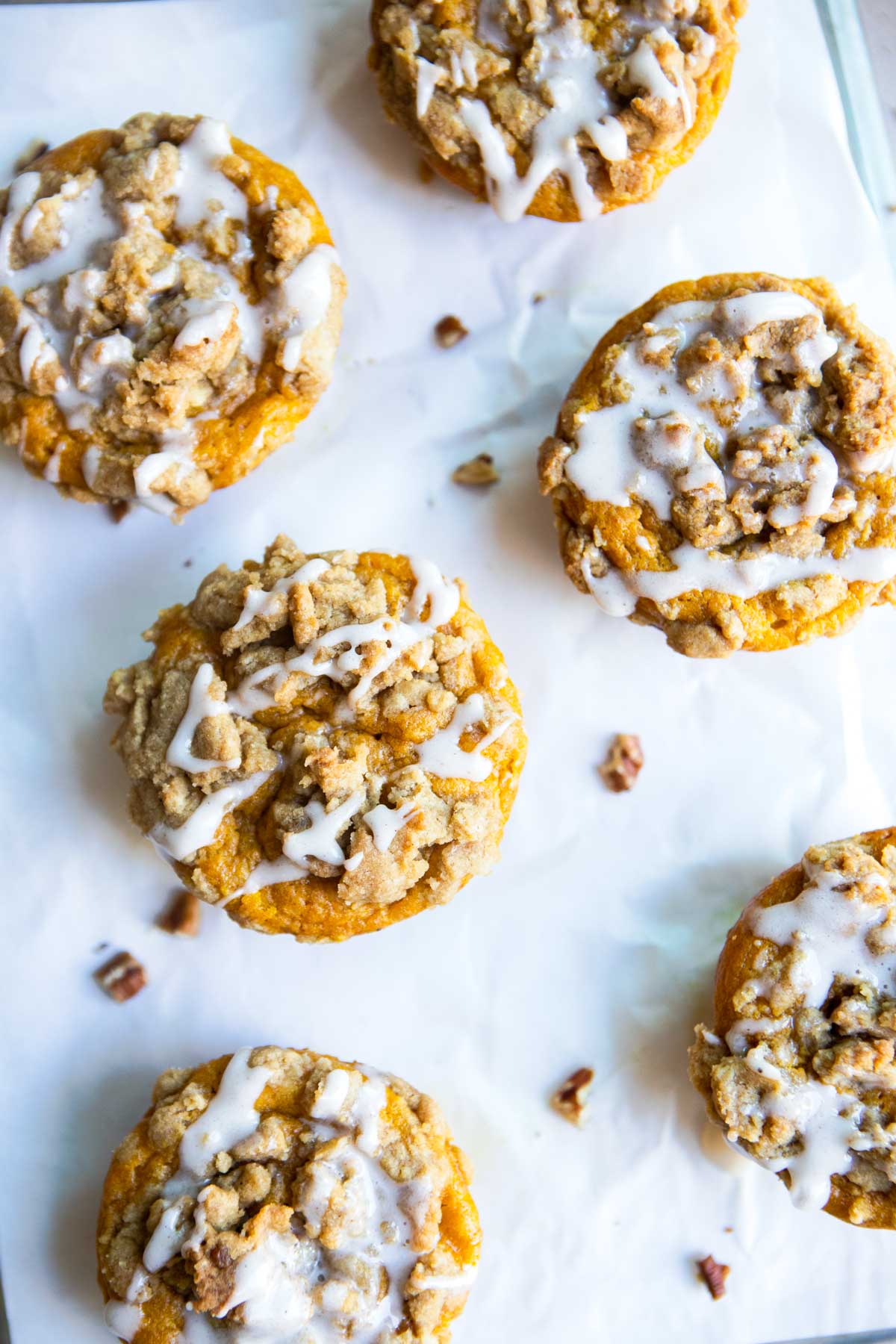 close up shot of pumpkin banana muffins baked and sitting on a sheet pan