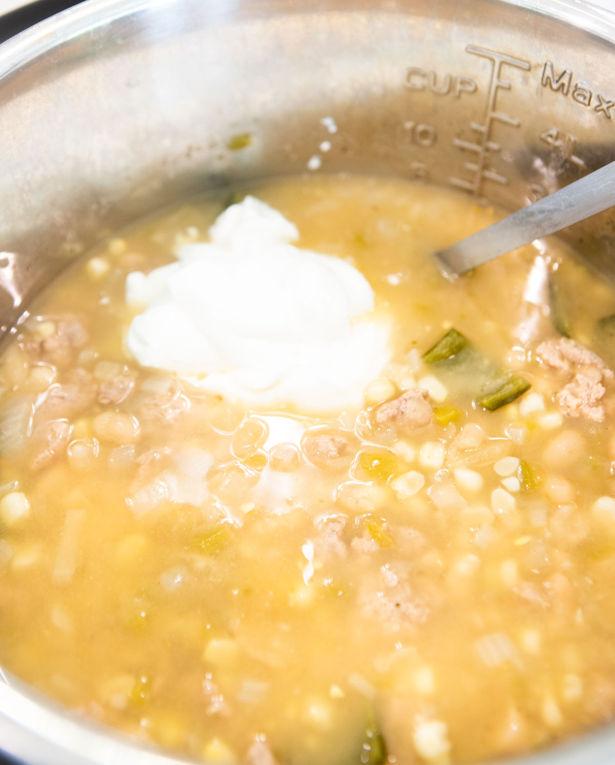 sour cream stirred into white chicken chili 