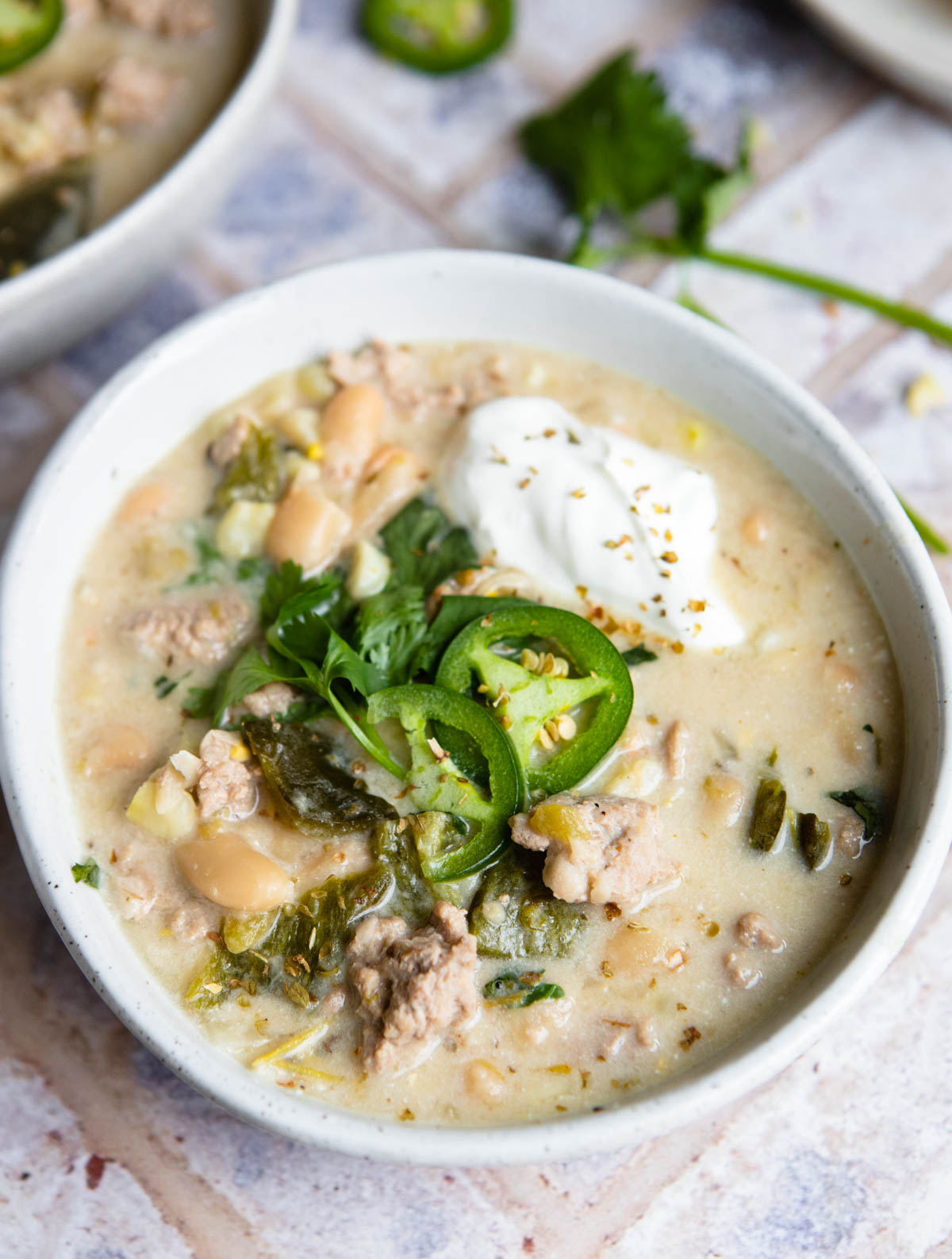 white chicken chili instant pot soup in a white bowl