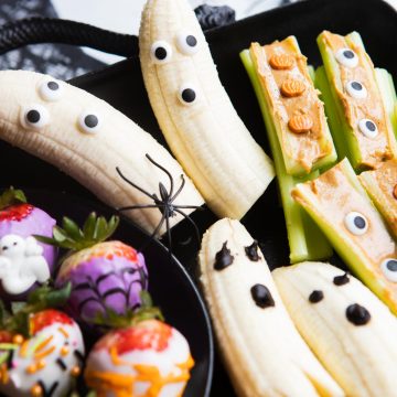 halloween themed snacks on a black metal tray