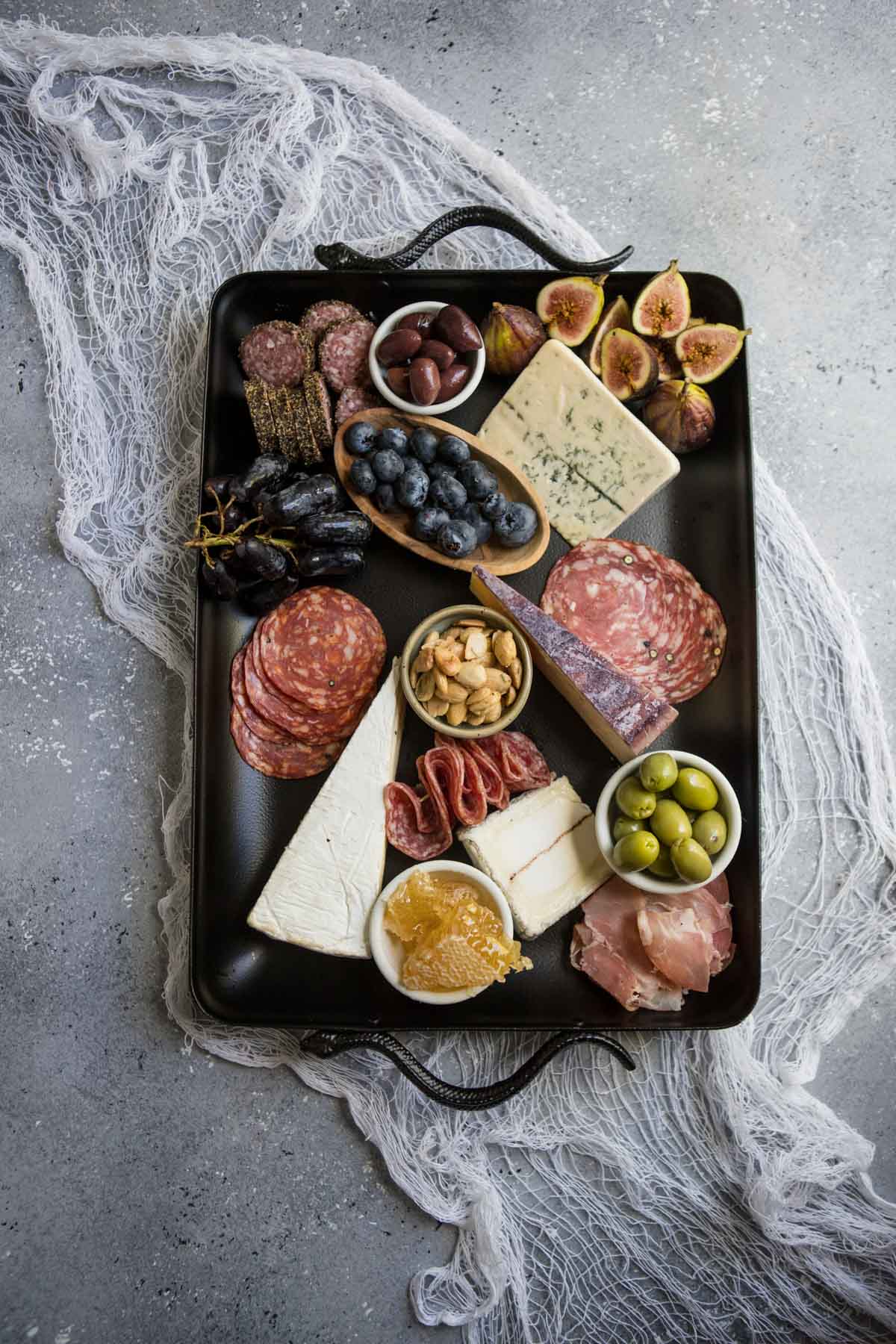 ingredients on a platter to make a spooky charcuterie board for Halloween