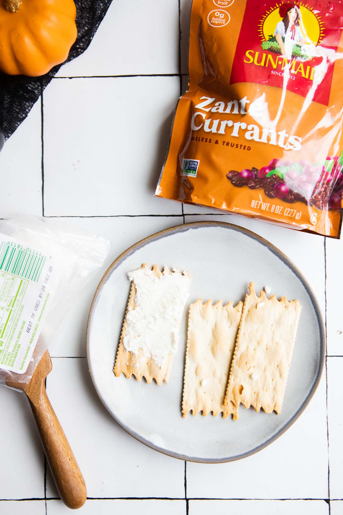 goat cheese spread on a rectangular cracker