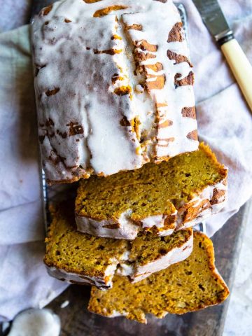 sliced healthy pumpkin banana bread with a glaze on top