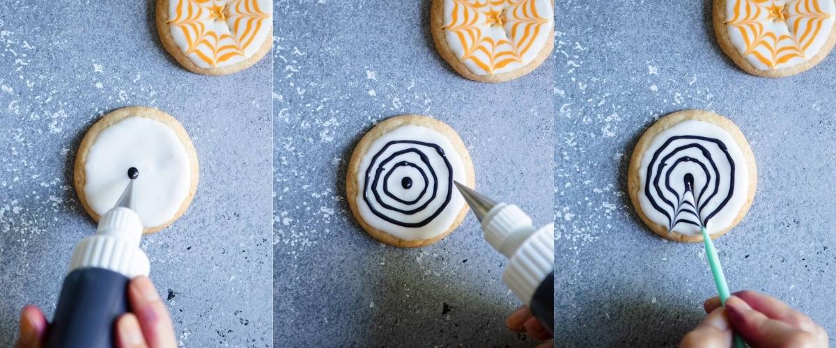 making spider web Halloween sugar cookies by adding black icing to a white iced cookie