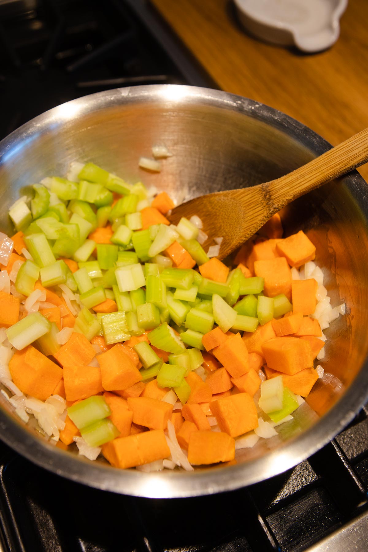 onions, carrots and celery sauteing in a large sauce pan