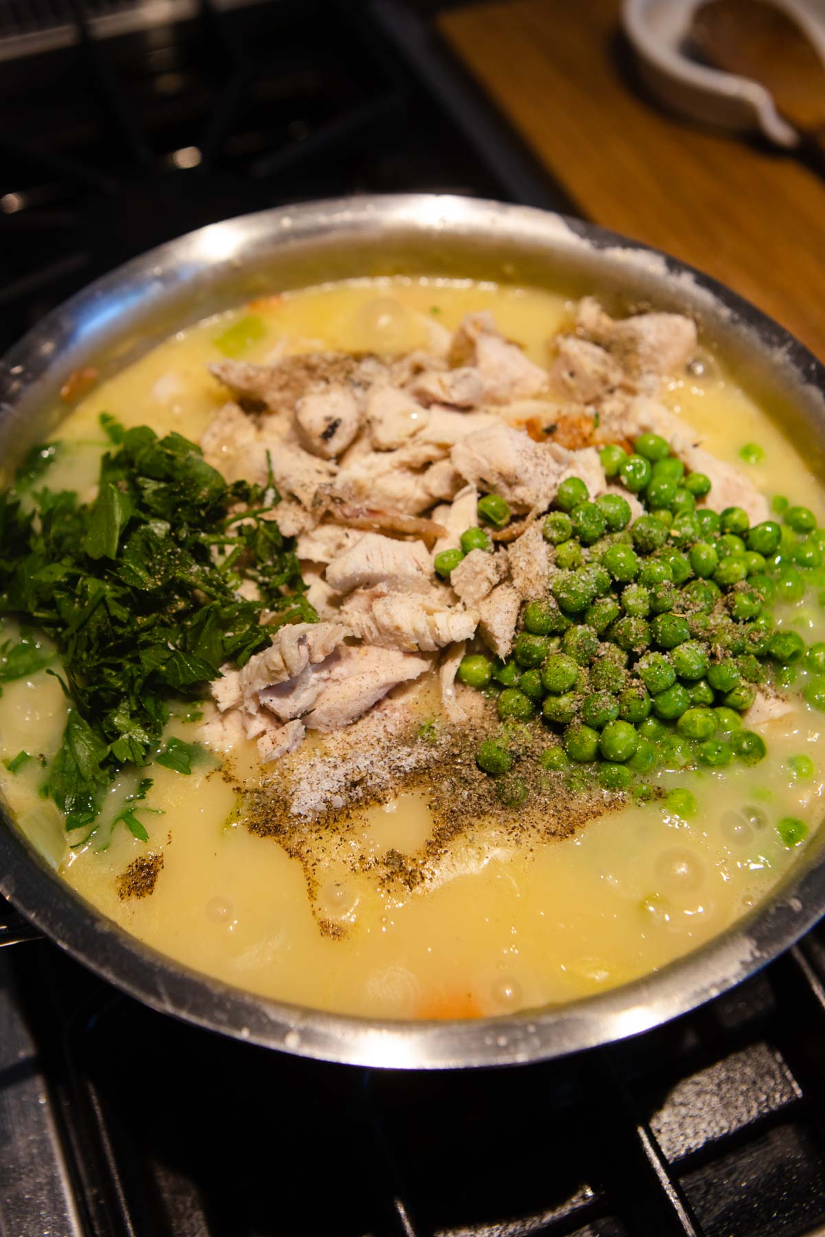 shredded turkey, peas and parsley added to a thick sauce to make pot pie