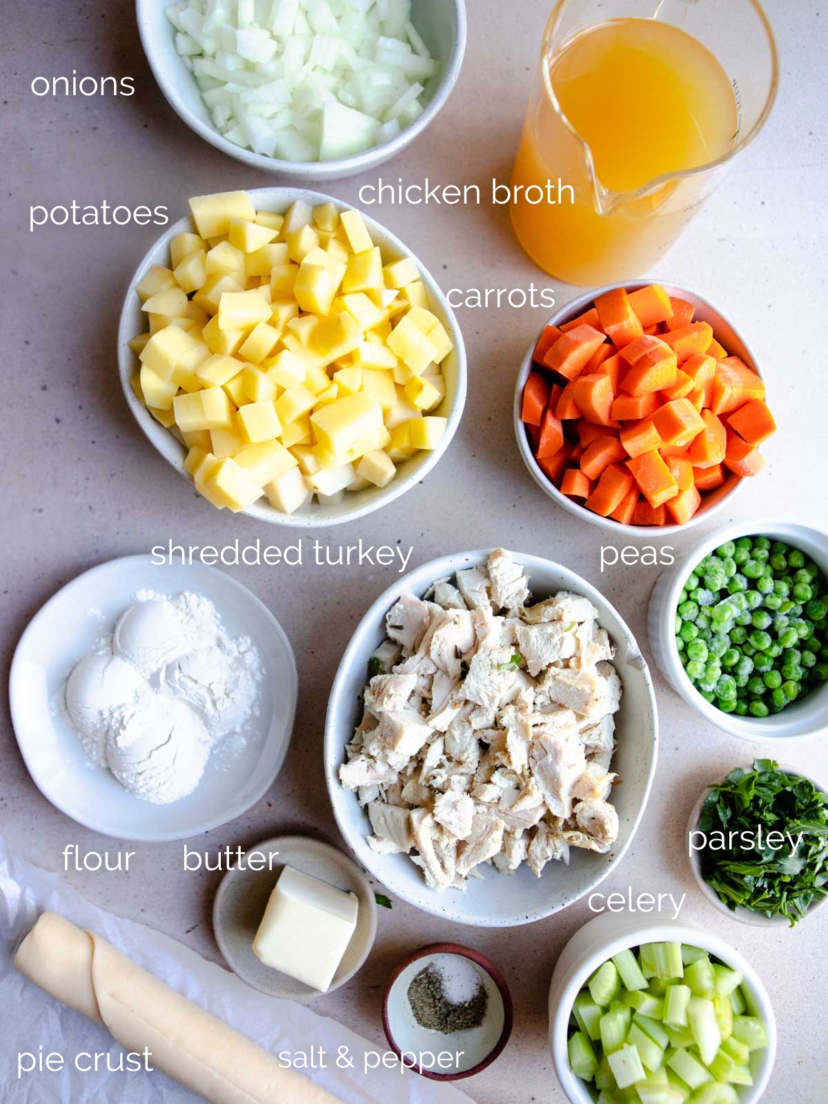 ingredients to make turkey pot pie in air fryer separated in small white bowls 