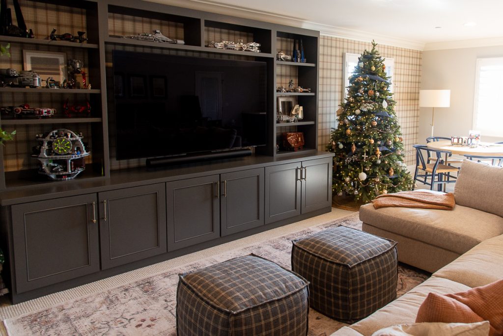 media center built in painted dark gray in a bonus room