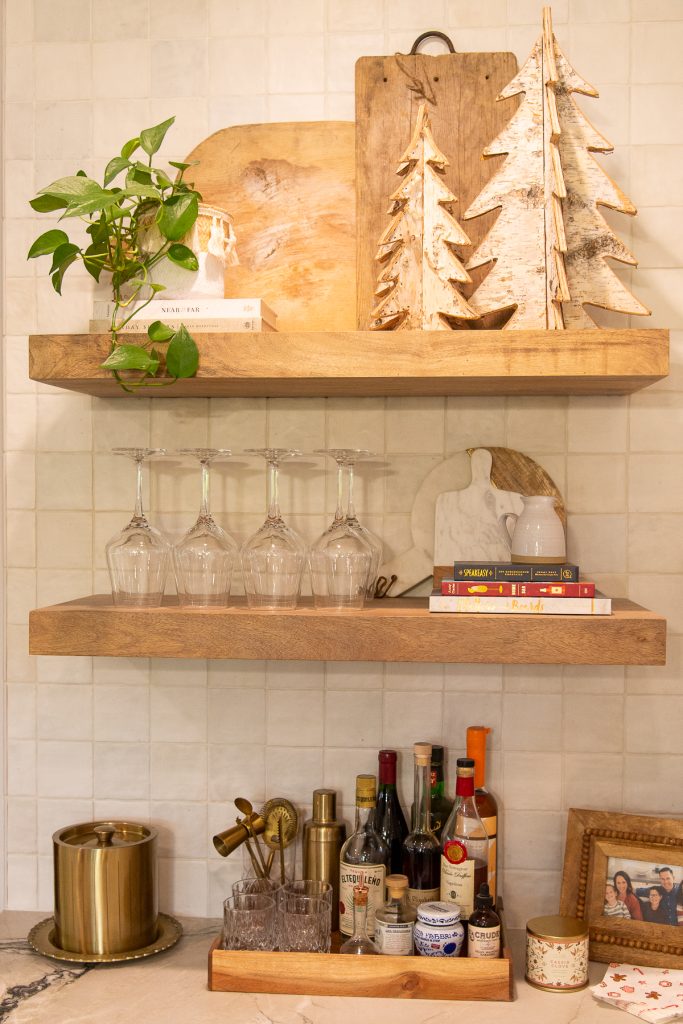 wet bar with glasses and christmas decor