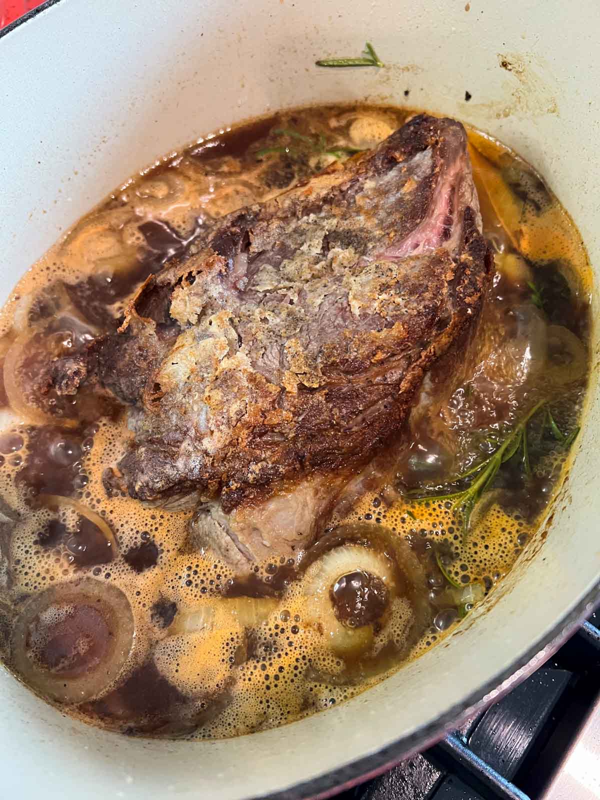 pot roast simmering in a dutch oven