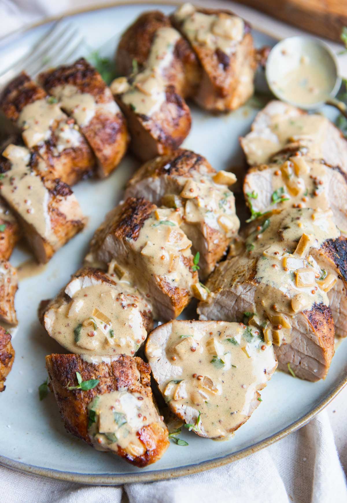 tender pieces of cut pork tenderloin with a creamy sauce smothered all over 