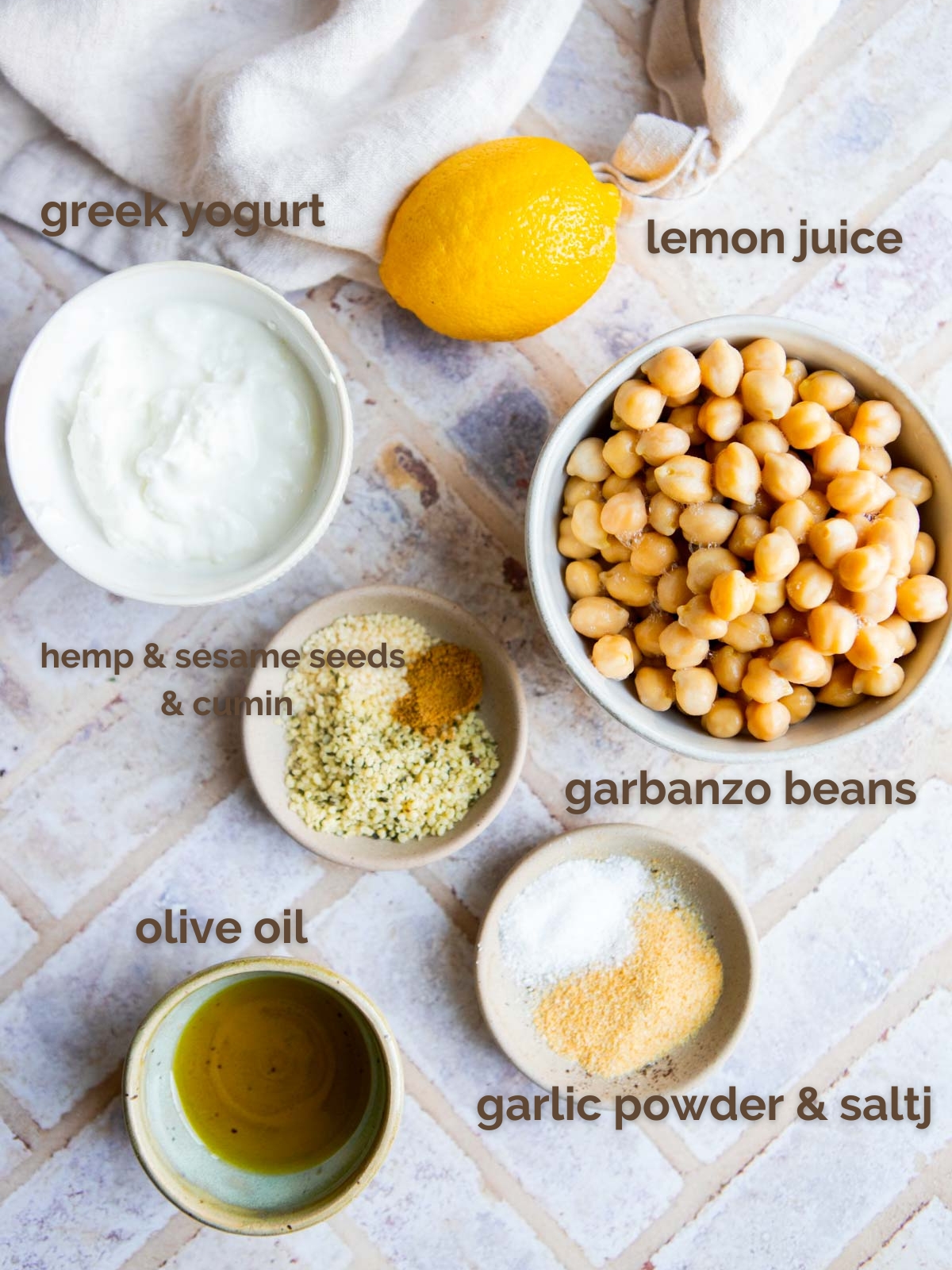 ingredients to make protein hummus in small white bowls 