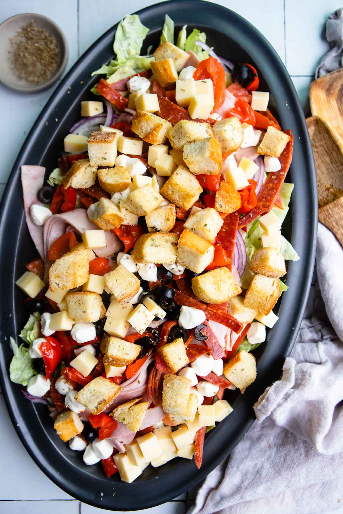 Italian sub salad on a big black platter