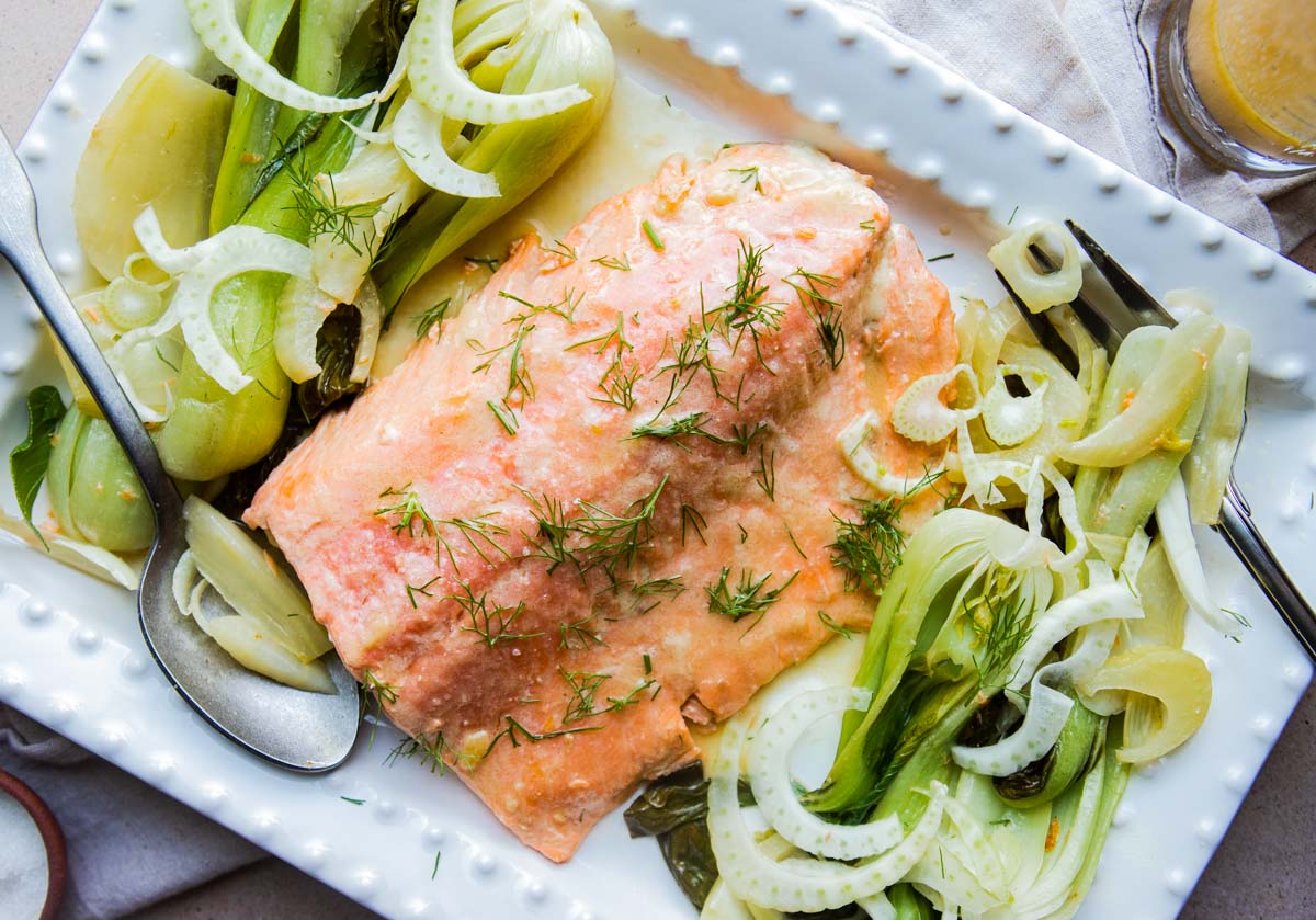 miso butter salmon on a white platter with fennel and baby bok choy 