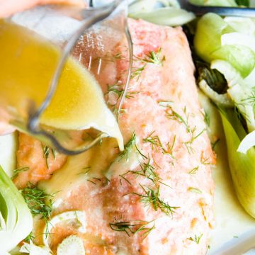 miso butter being poured over salmon filet