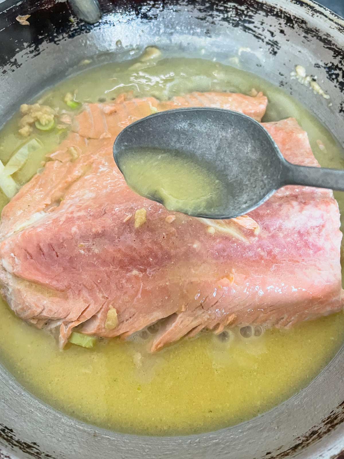 miso butter salmon basting in pan