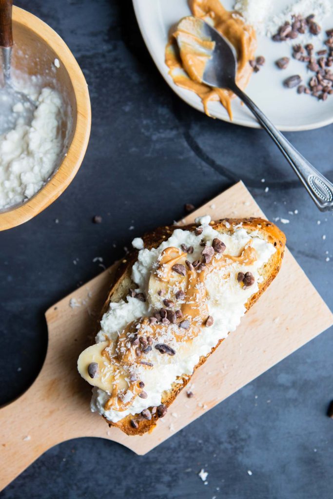 cashew butter and sweet cacao nibs on cottage cheese toast