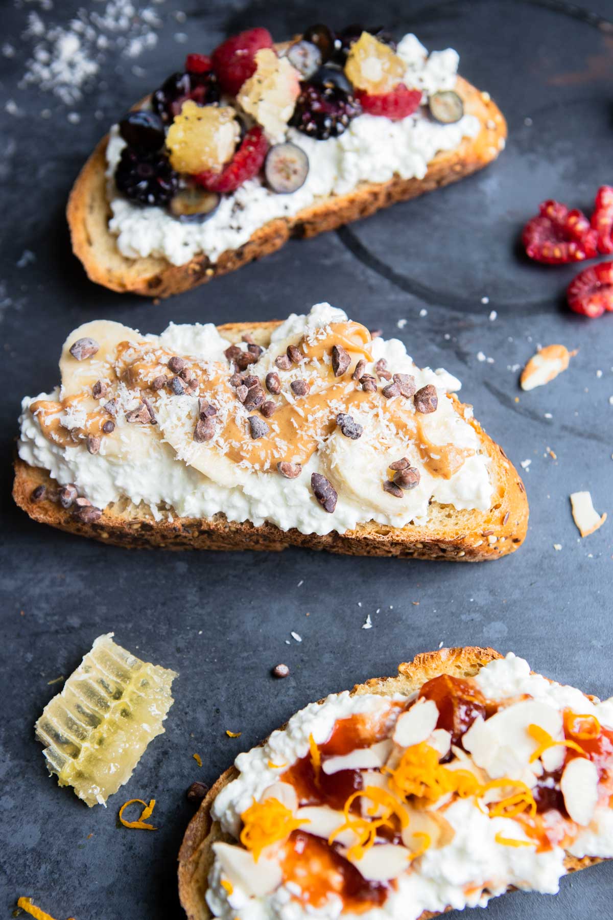 sweet toppings on a piece of toast topped with cottage cheese 