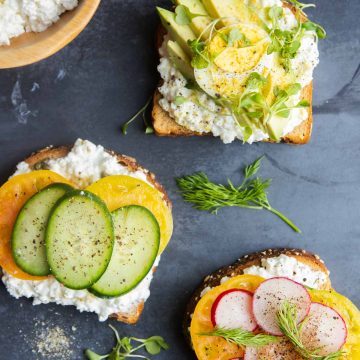 toast with cottage cheese spread on it and various vegetable toppings