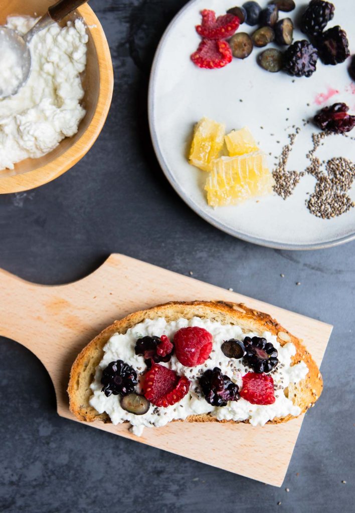 fresh berries and chia seeds on cottage cheese toast