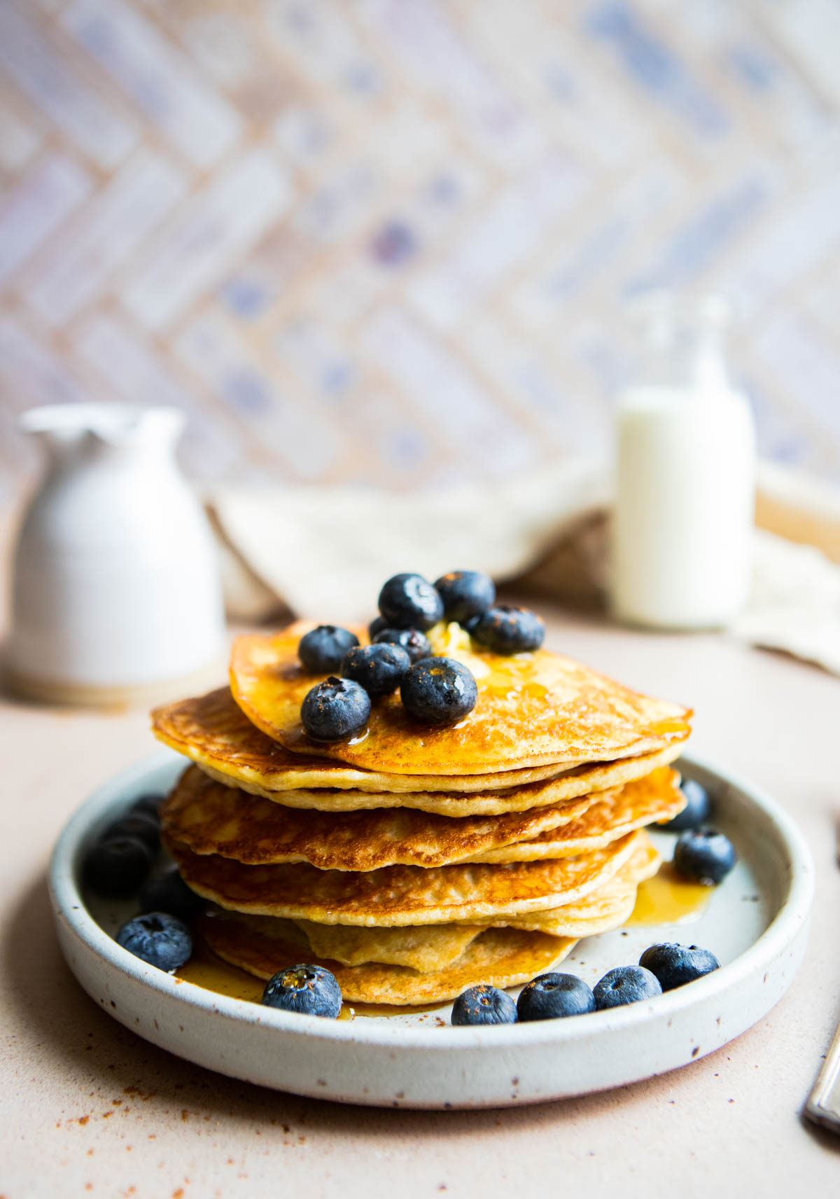 blueberries topped on a stack of high protein pancakes made with cottage cheese and egg whites and not protein powder